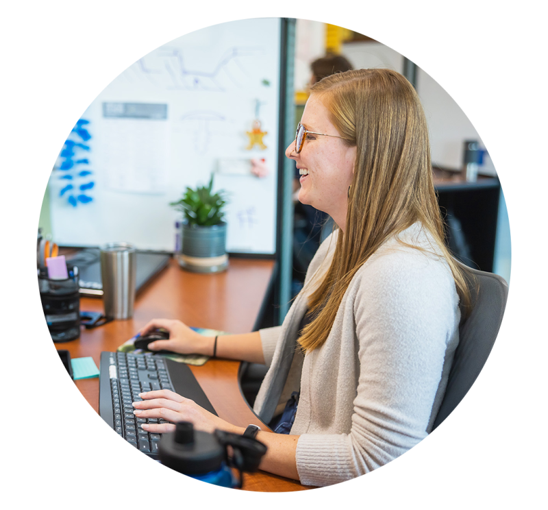 Kelly Martin, Design Engineer, Working at her Desk at Re:Build Tekna