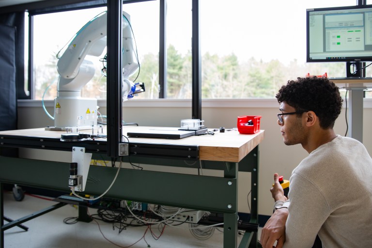 Engineer working on robotic arm