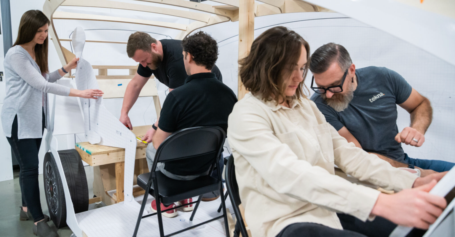 Designers and engineers working on a prototype